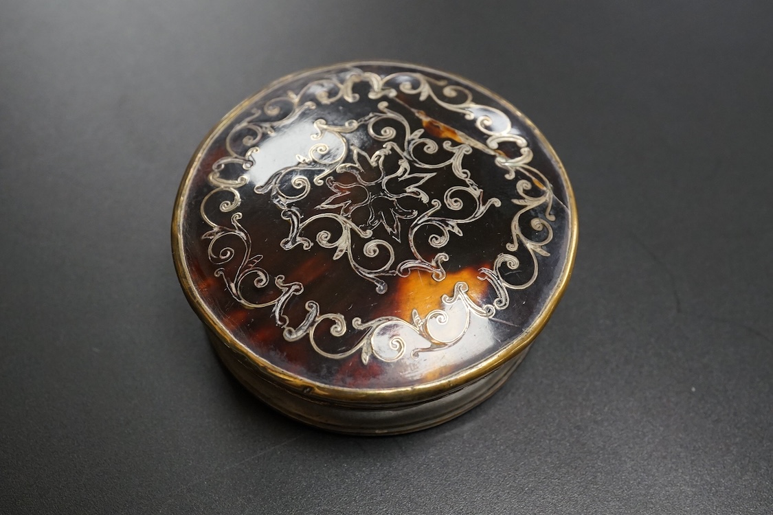 A collection of 19th century and later silver and white metal mounted items comprising three boxes, two glass scent bottles and a folding mother of pearl pen knife, largest 7.5cm high